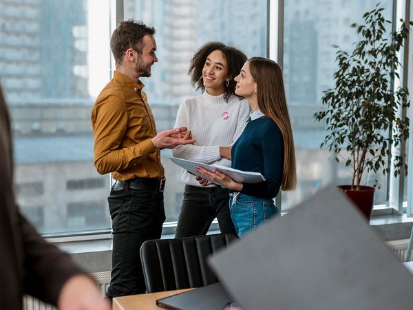 Three people, discussion, work environment