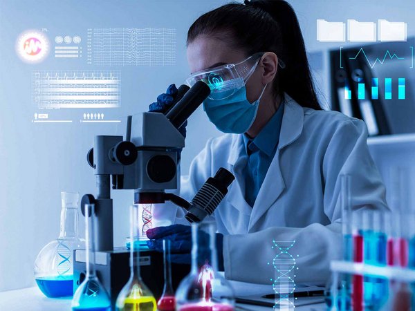 Laboratory, data, woman looking through a microscope