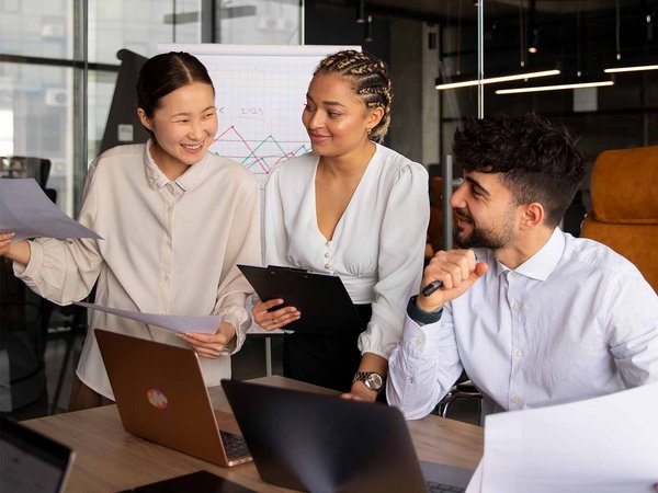 Group meeting with laptops in an office