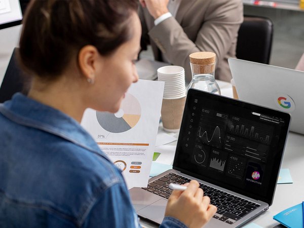 Woman at laptop, analysis, diagram