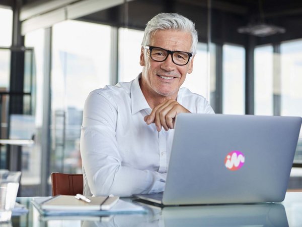 Man at laptop, office