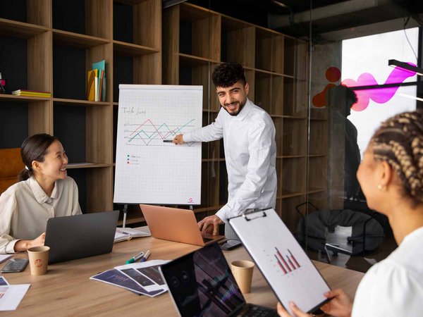 Man giving a presentation on the flip chart