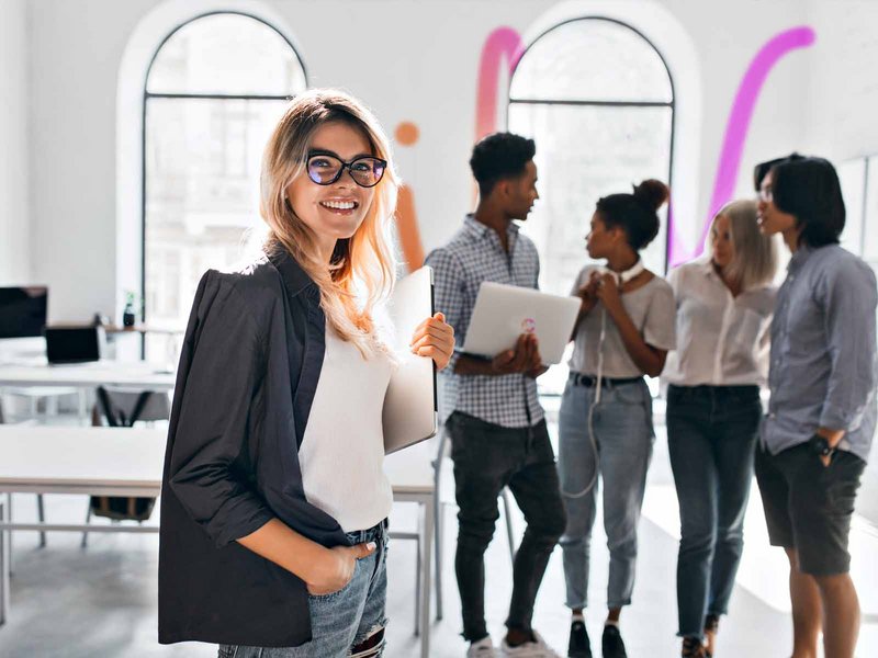 Woman stands in front of INFOMOTION group