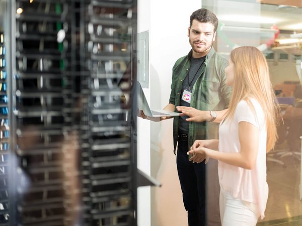 Woman and man in front of server