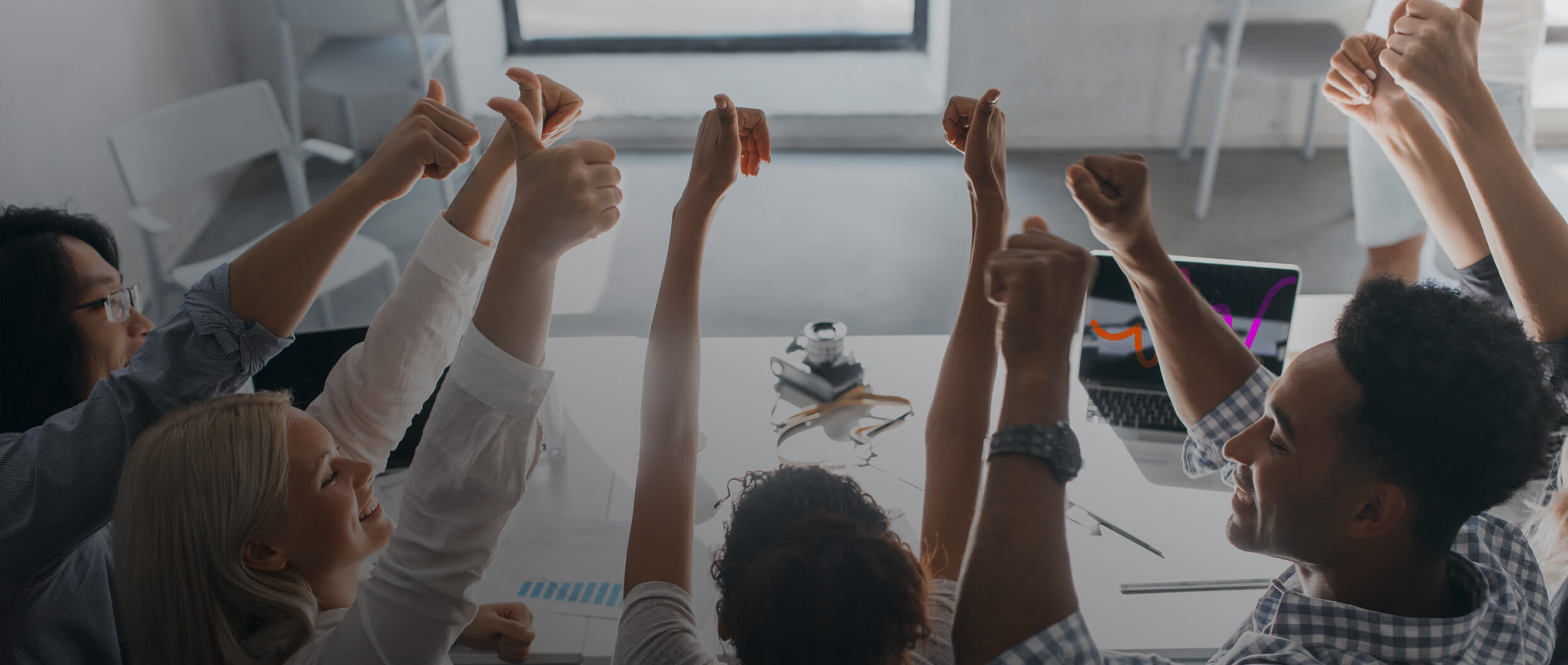 Group of people celebrating at work